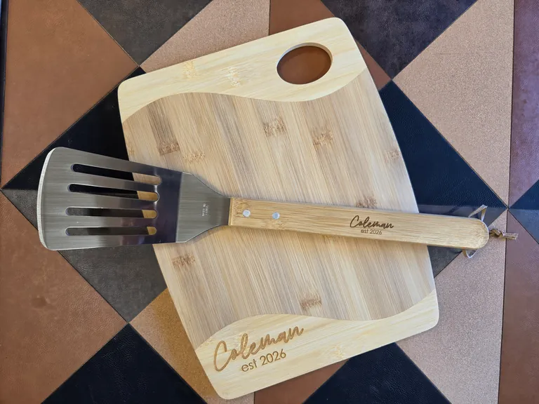 Personalized laser-engraved bamboo cutting board and spatula
